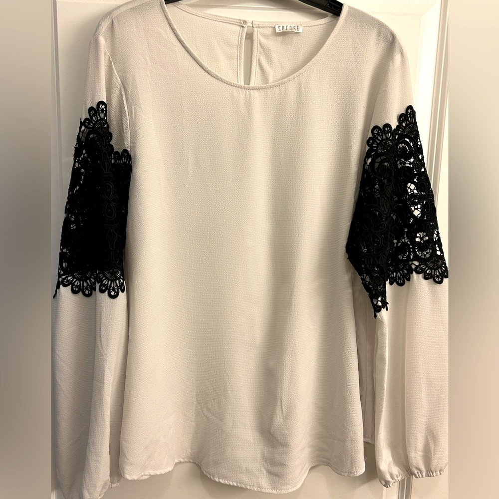 White blouse with black crochet sleeves
